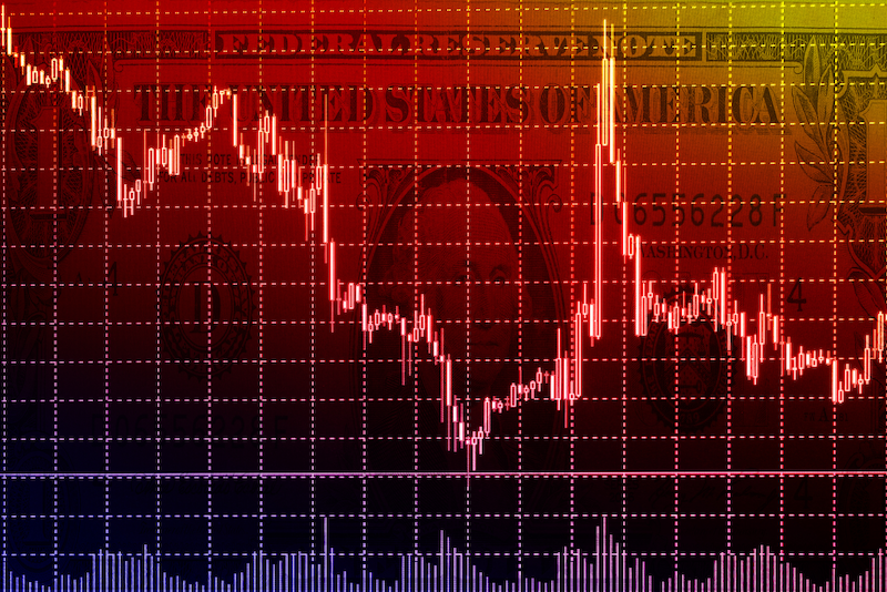 Colorful stock market graph superimposed over US dollar bill